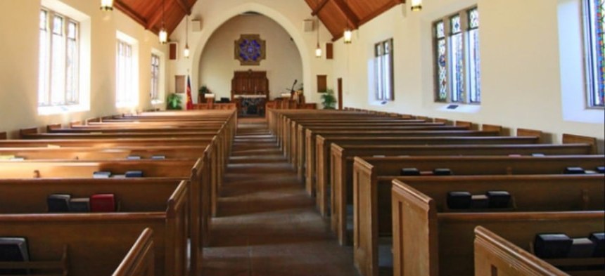 Sanctuary with wooden pews leading to the altar