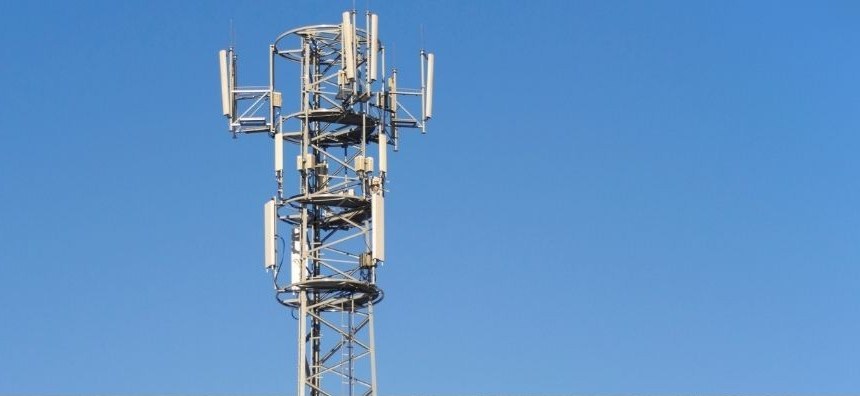Telecommunications tower against a blue sky