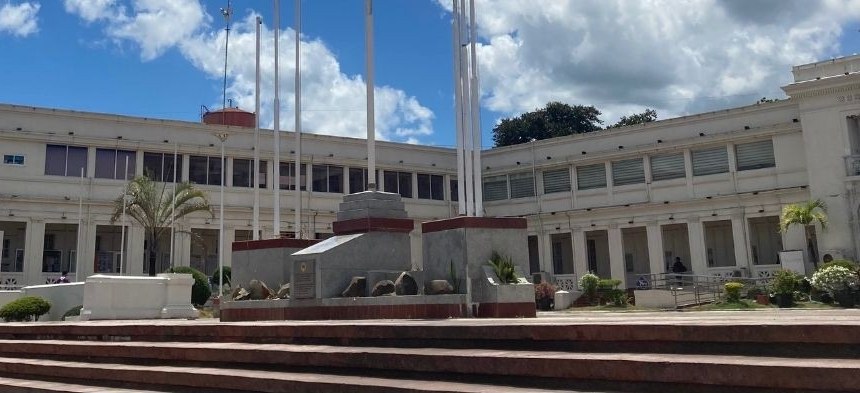 Public government building with flagpoles and front steps
